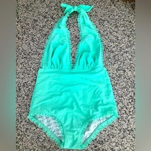 One-piece Mint Green Halter Swimsuit, with ruffle trim. Size S byMarilyn Monroe